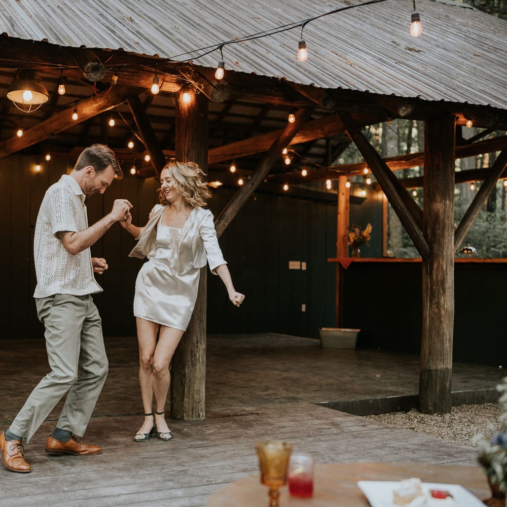 Marjean and Dan start the dancing in their reception attire at Loloma Lodge