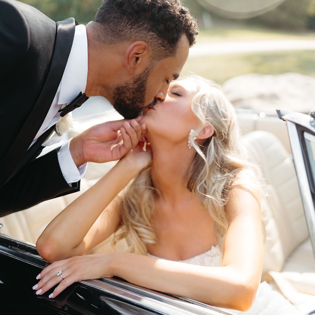 Annie and Jordan Share a Kiss in their Vintage Car at La Pointe Events