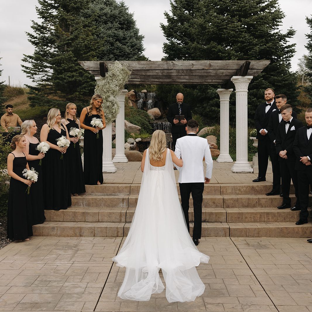 Bride and Groom Ascend Stairs in Wedding Ceremony
