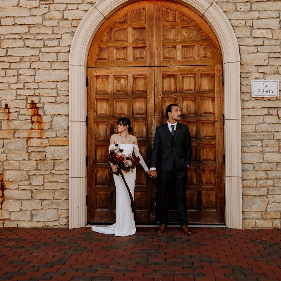 Autumn-inspired wedding shoot at a Tuscany-style winery with rich florals, warm tones, and elegant details.