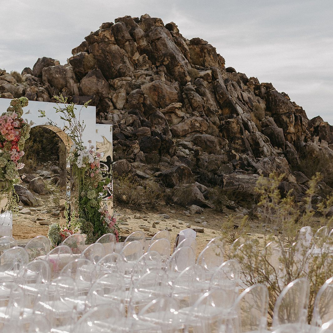 Eclectic desert ceremony space with mirrored altar and vibrant florals at Morada in Joshua Tree