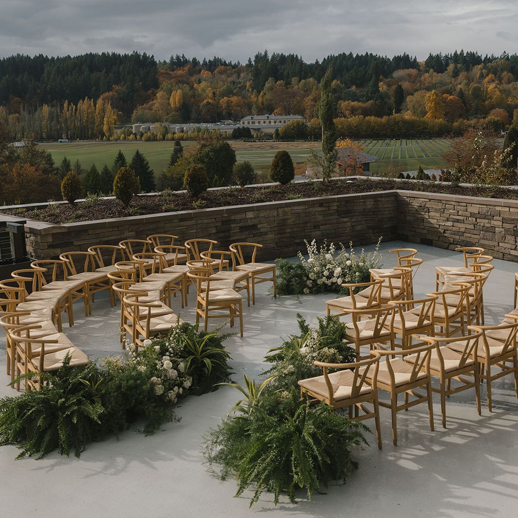 Circular outdoor reception adorned with lush greenery in imagined wedding day at SOMM Hotel & Spa