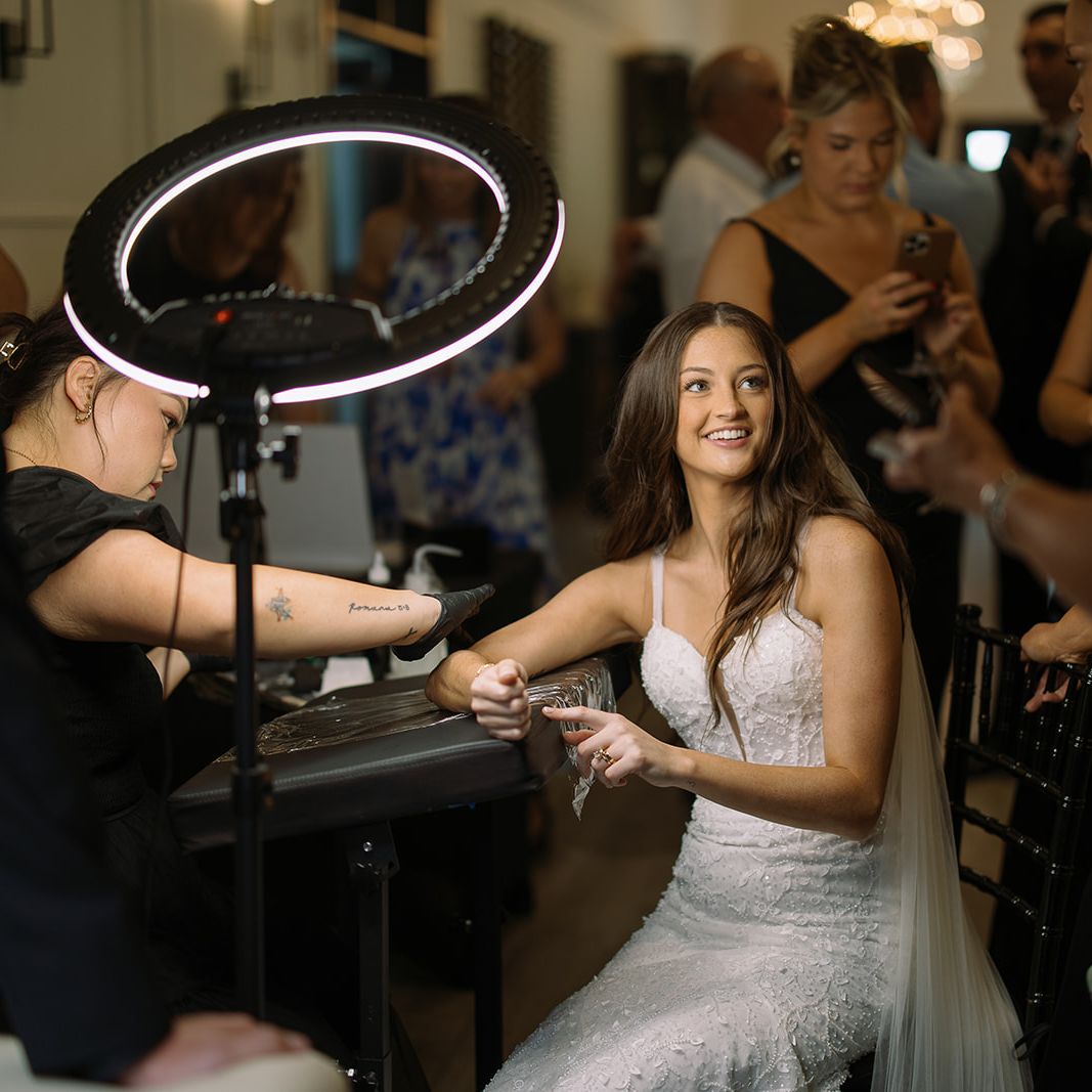 Bride receives a tattoo during her cocktail hour in wedding day at The LedgeCrest Reserve