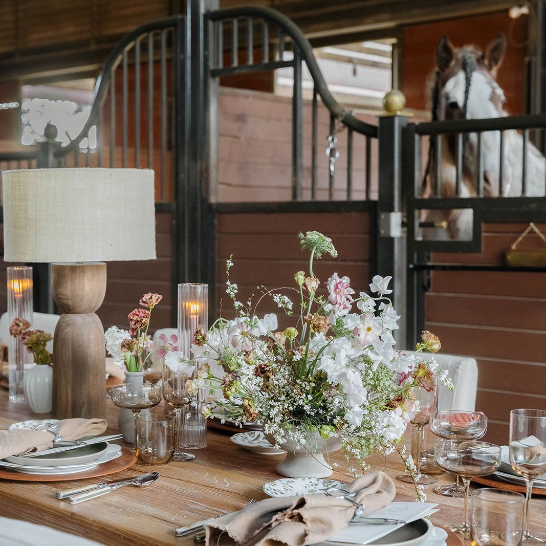 Earthy tablescape in the midst of a horse barn at TERI campus of life