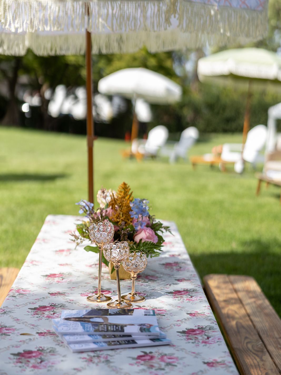 Floral table décor and outdoor event seating on the lawn at Rodney Strong Vineyards