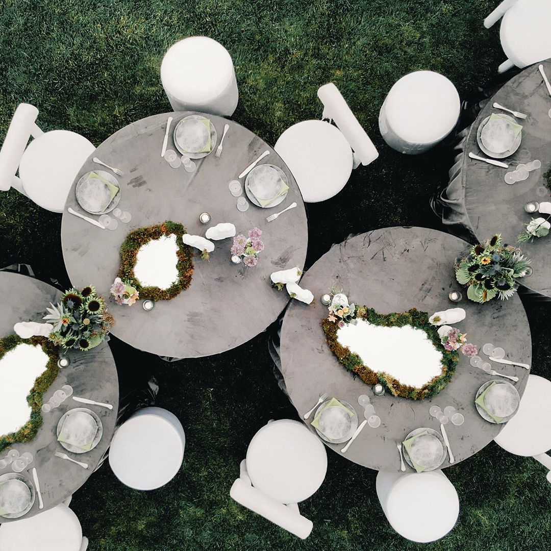 Aerial view of reception tablescape featuring storm-grey hues and mirrored details at Grand View Malibu