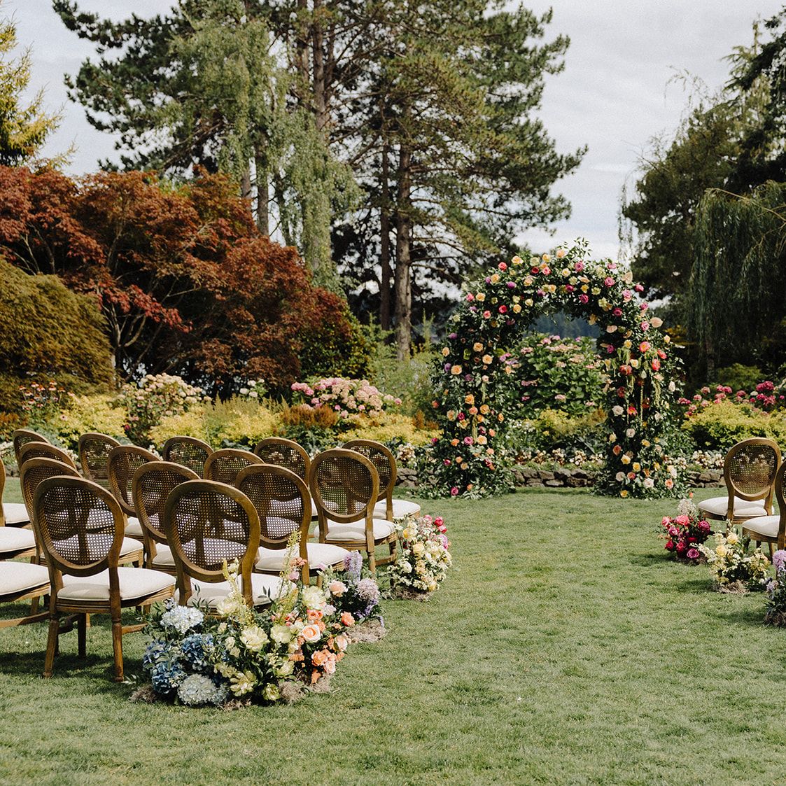 Lush floral-forward ceremony scene at Kiana Lodge