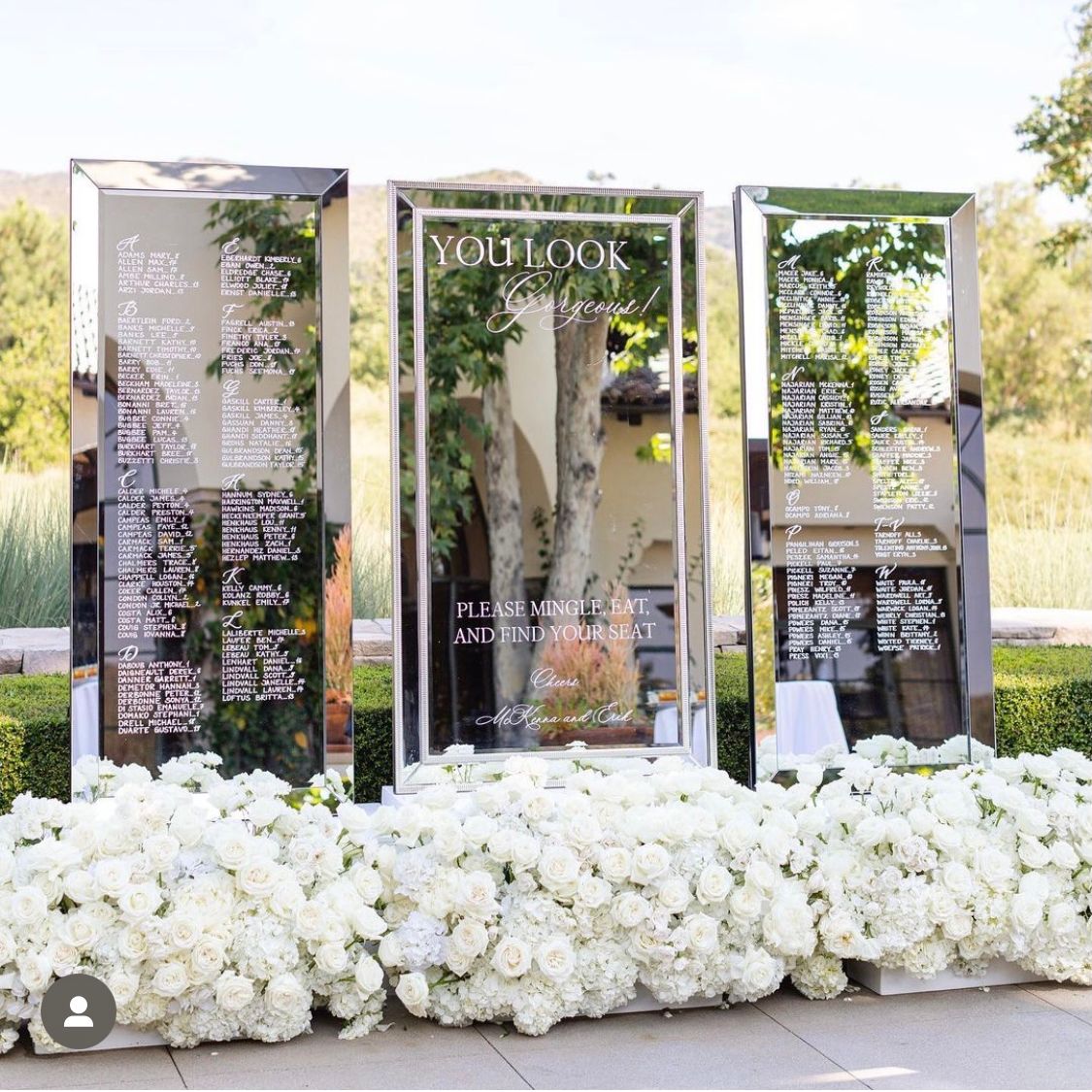 2024-04/Modern classic elegent wedding seating chart mirrors with flowers in los angeles and orange county.jpg