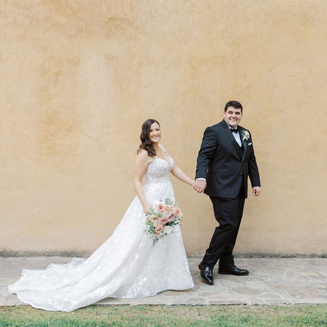 Samantha and Ryan walking the grounds of Villa del Sol d'Oro on their wedding day