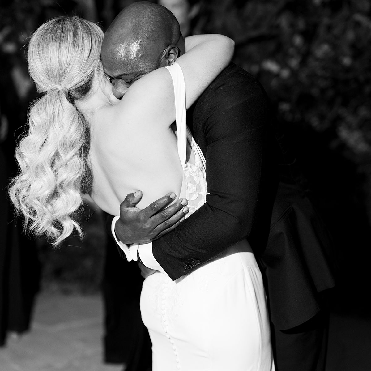 Bride and groom Johanna and Chris embrace in an emotional black-and-white wedding portrait by Brittany Nemec Photography