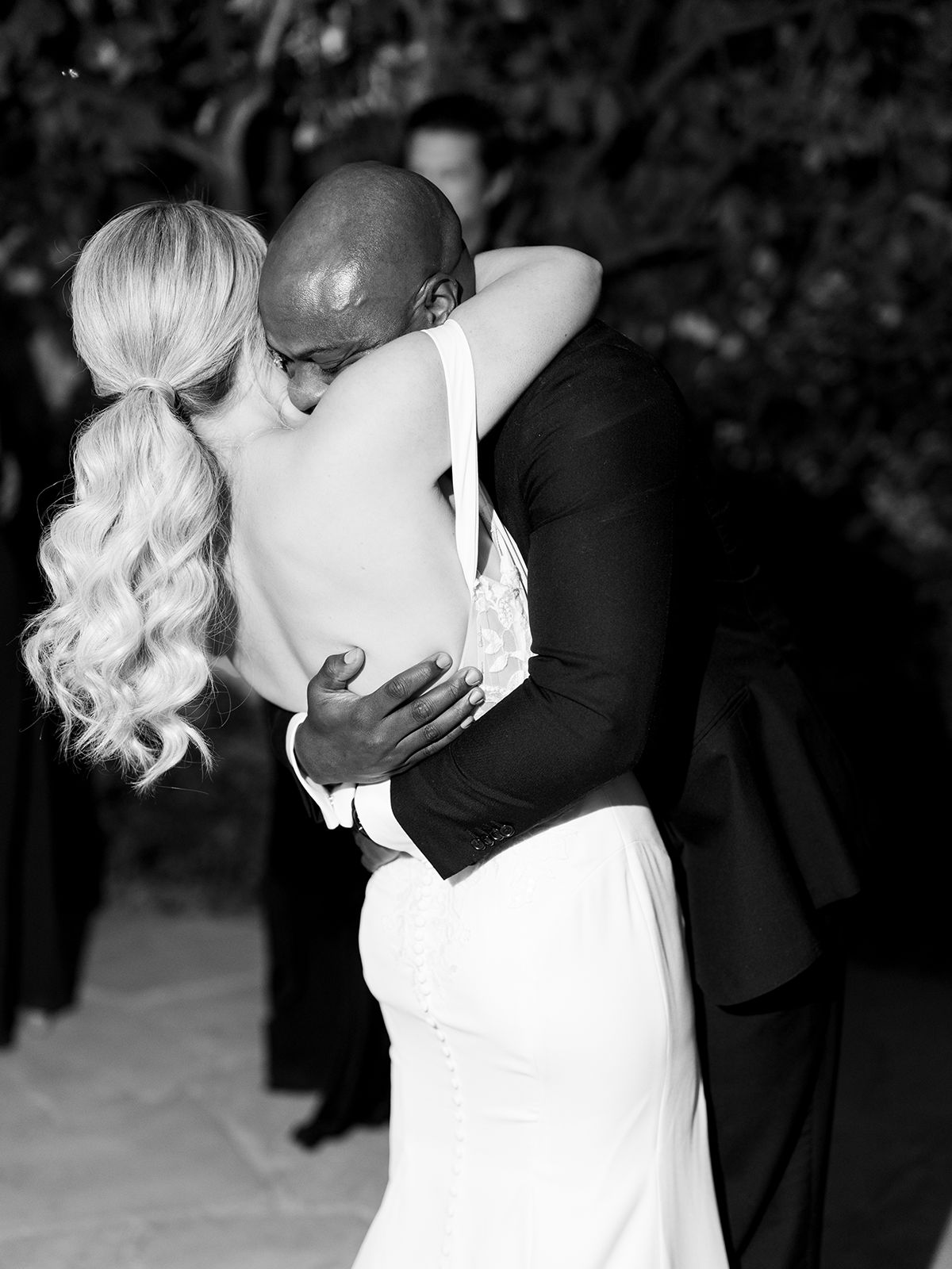 Bride and groom Johanna and Chris embrace in an emotional black-and-white wedding portrait by Brittany Nemec Photography