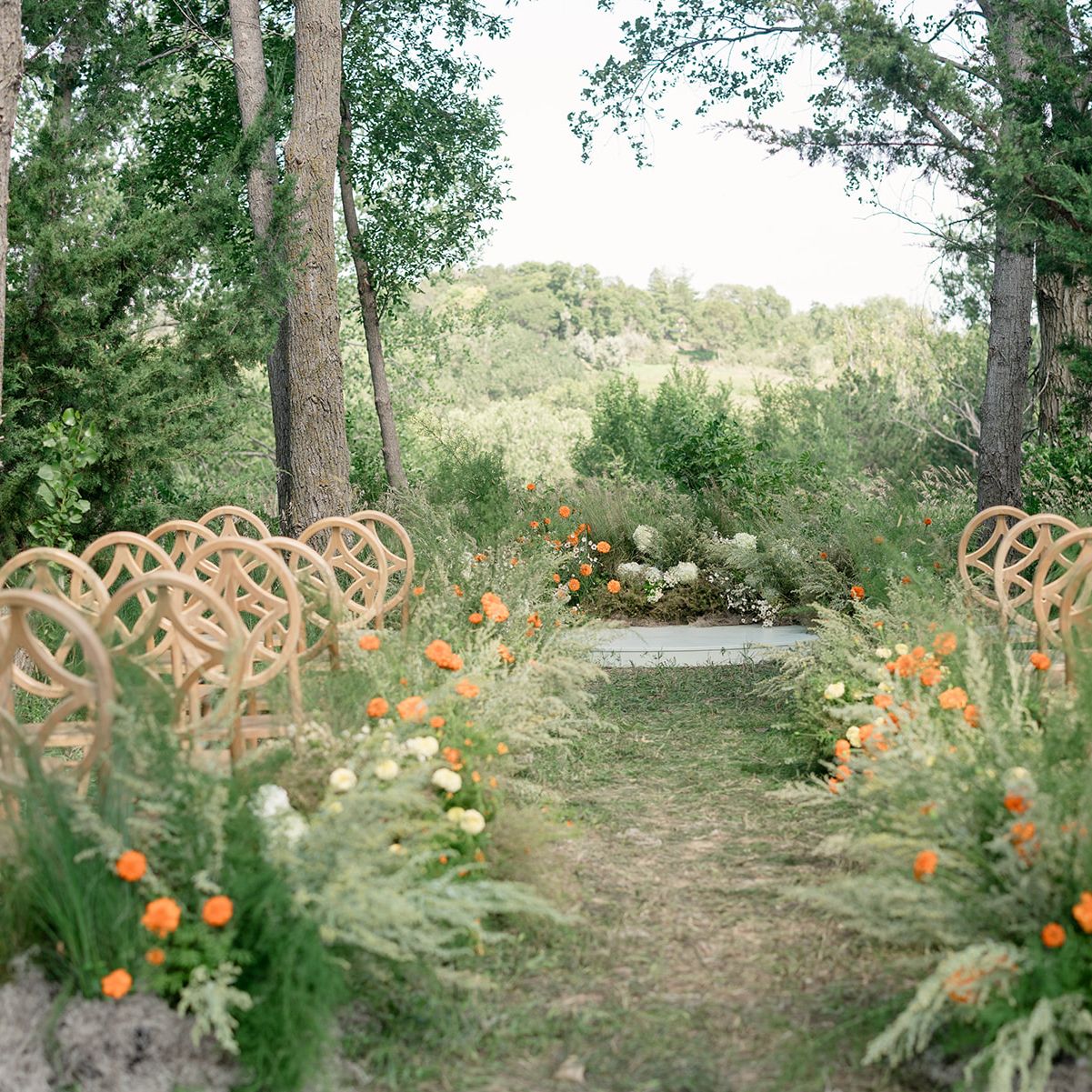 lush organic florals and modern altar in ceremony scene at Petal and Thorn Flower Farm