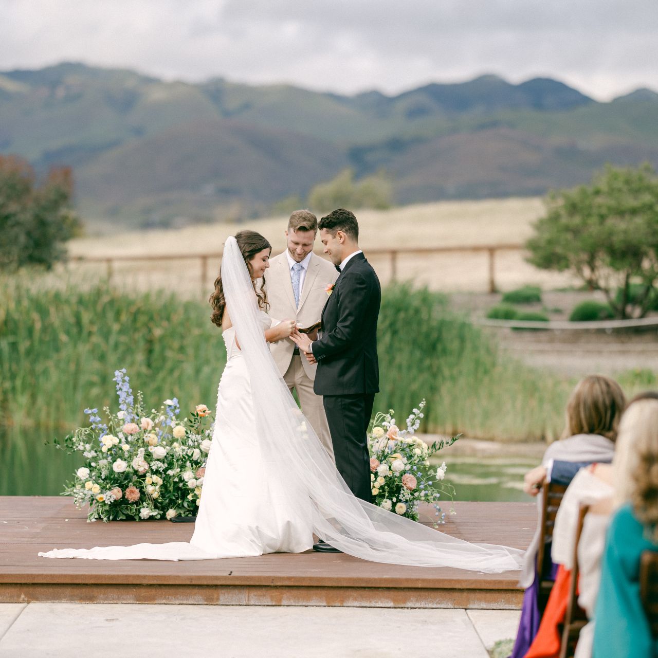 Bride and groom at the altar during their ceremony against the scenic views at Cavalli Estates