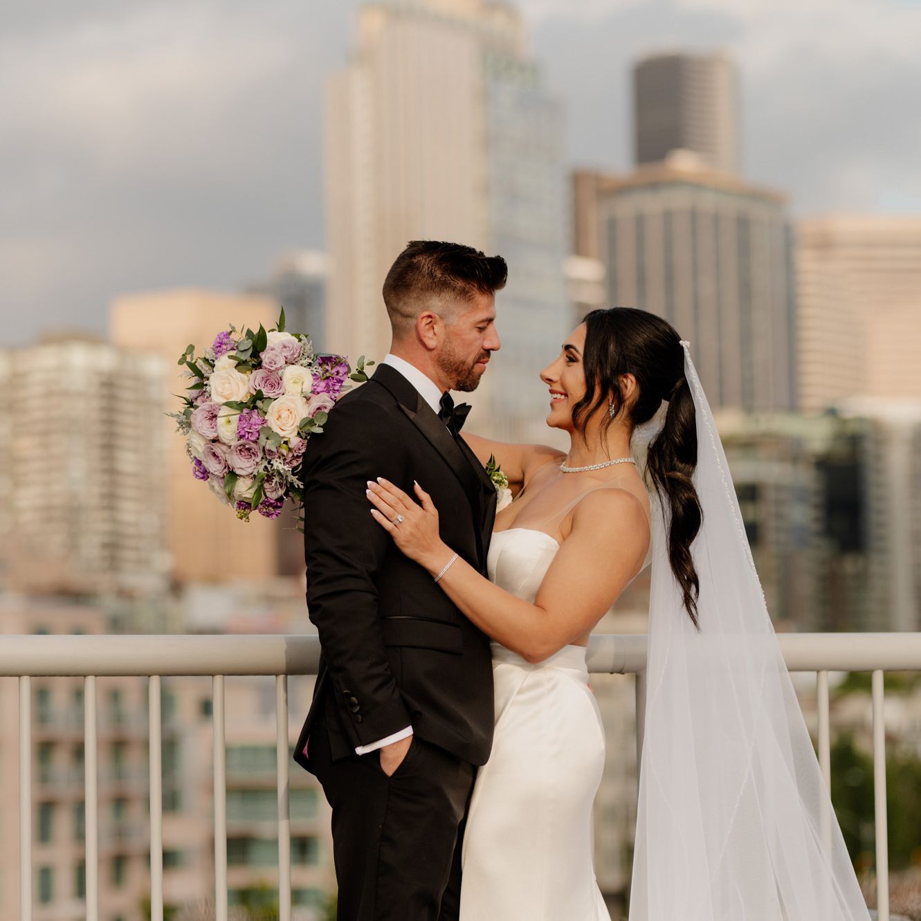 Donya and Rick embrace against scenic Seattle backdrop