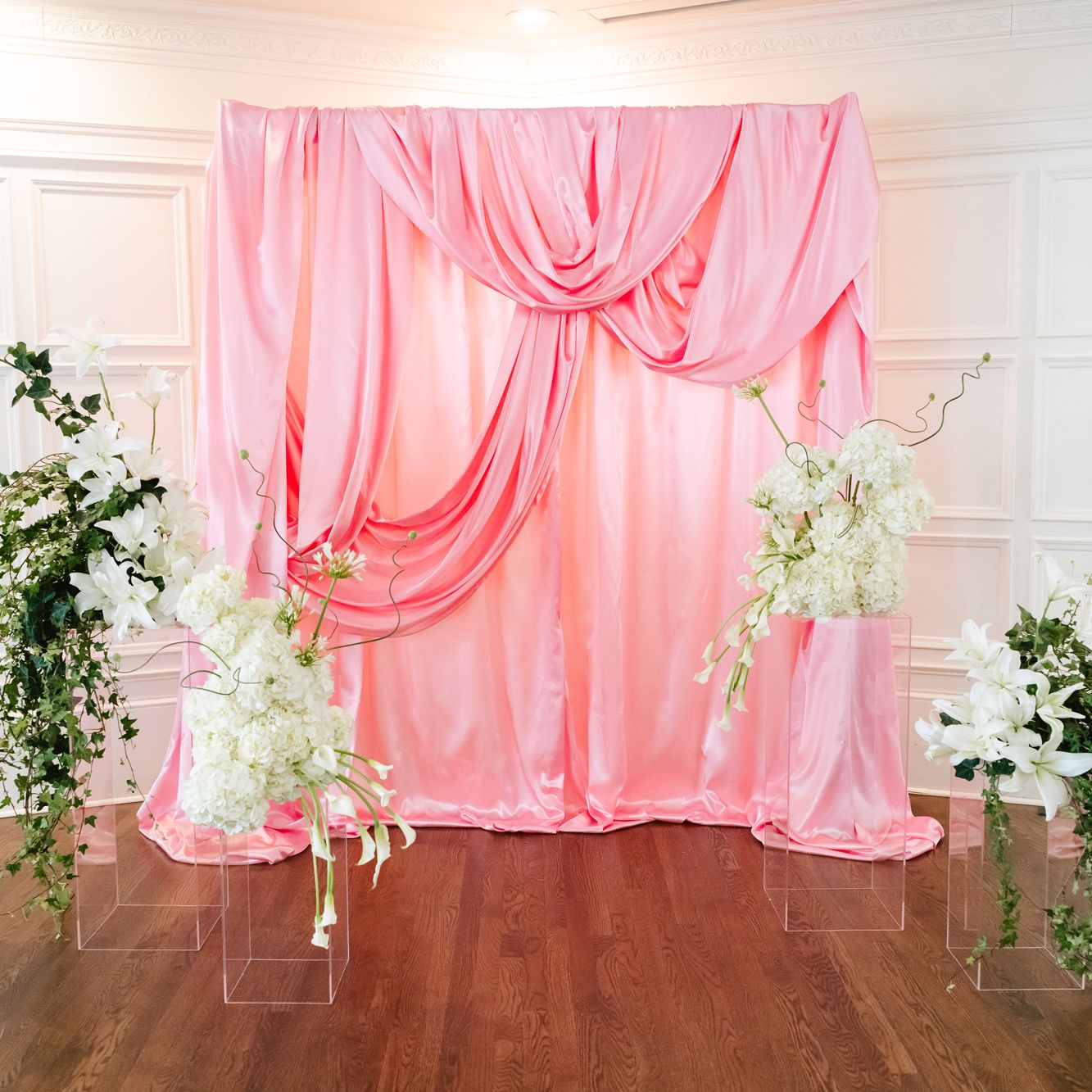Pink satin kitschy ceremony backdrop at St. Paul College Club