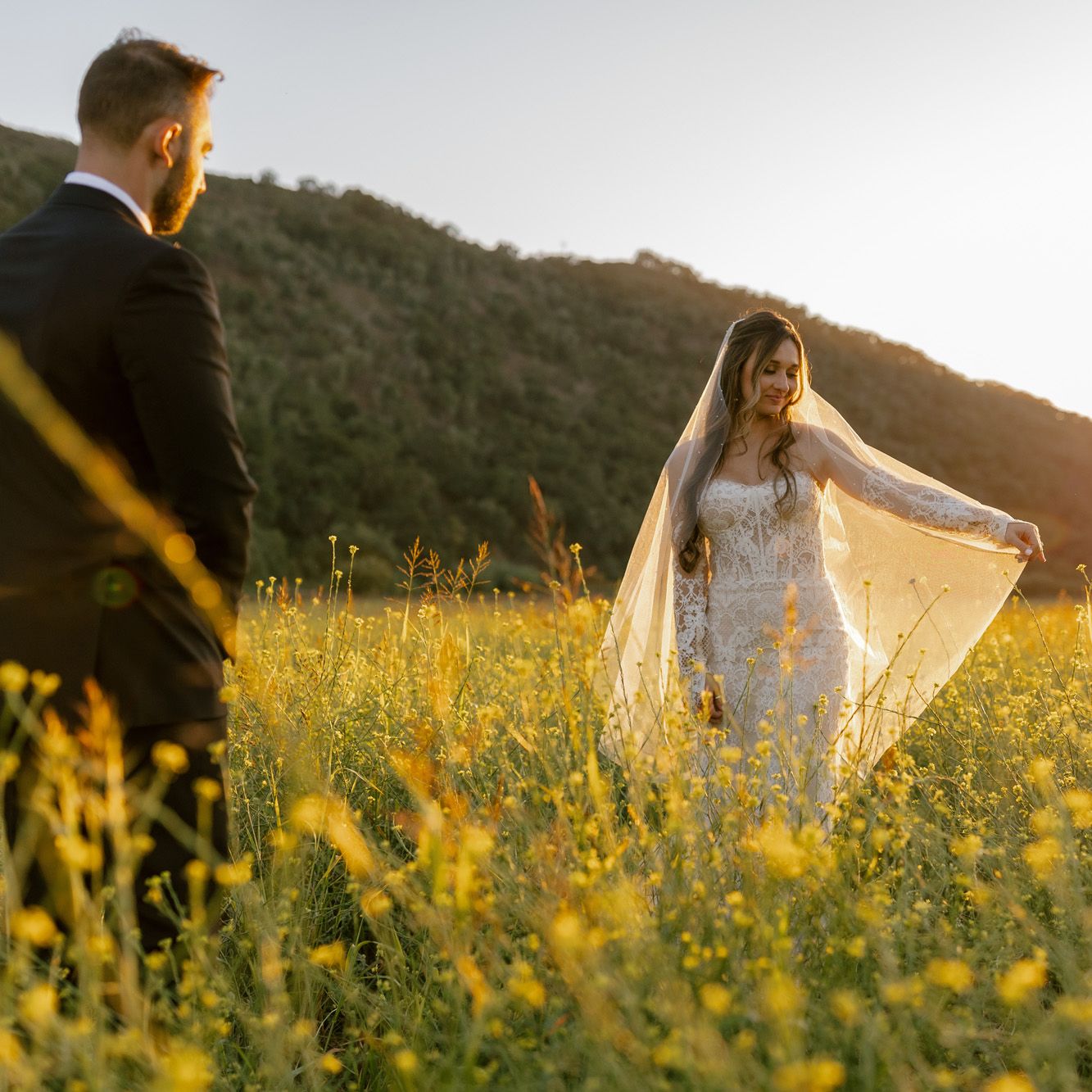 Morgan and Anthony pose in the mustard field of Tar Creek Ranch on their wedding day