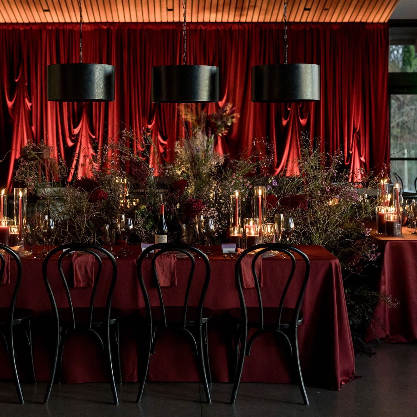Rich red monochromatic reception scene at Amaterra Winery
