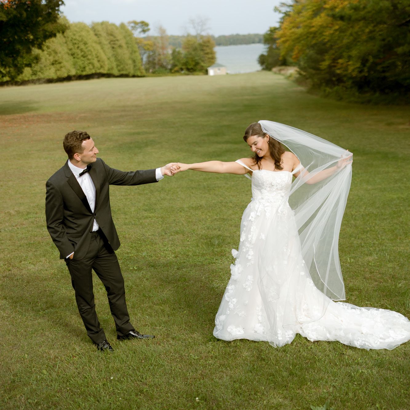 Clare and Tom pose on their wedding day at Alpine Resort