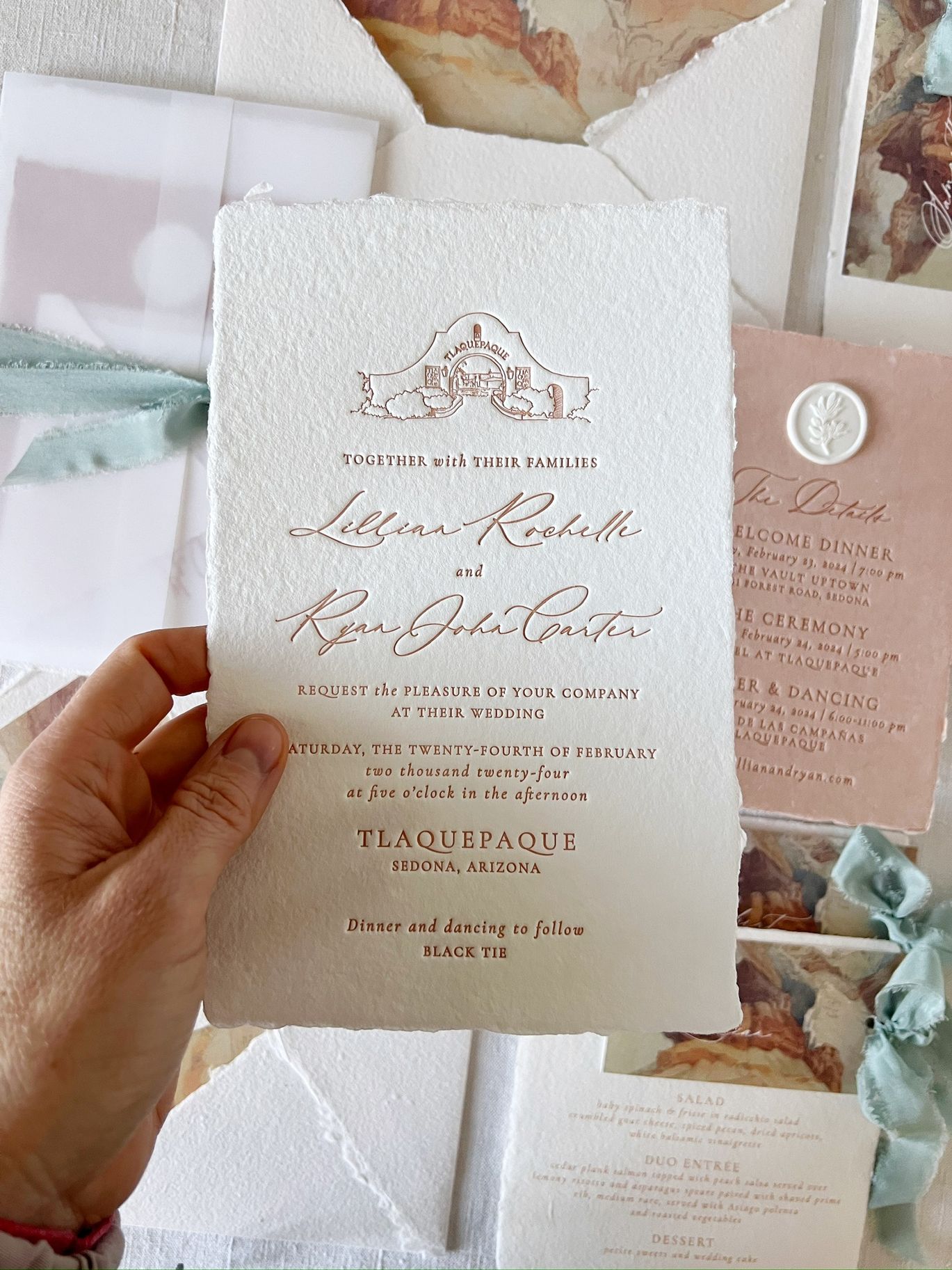 Ashley Bunten Design wedding invitations featuring handmade white paper, terracotta letterpress and watercolor Sedona landscape details.