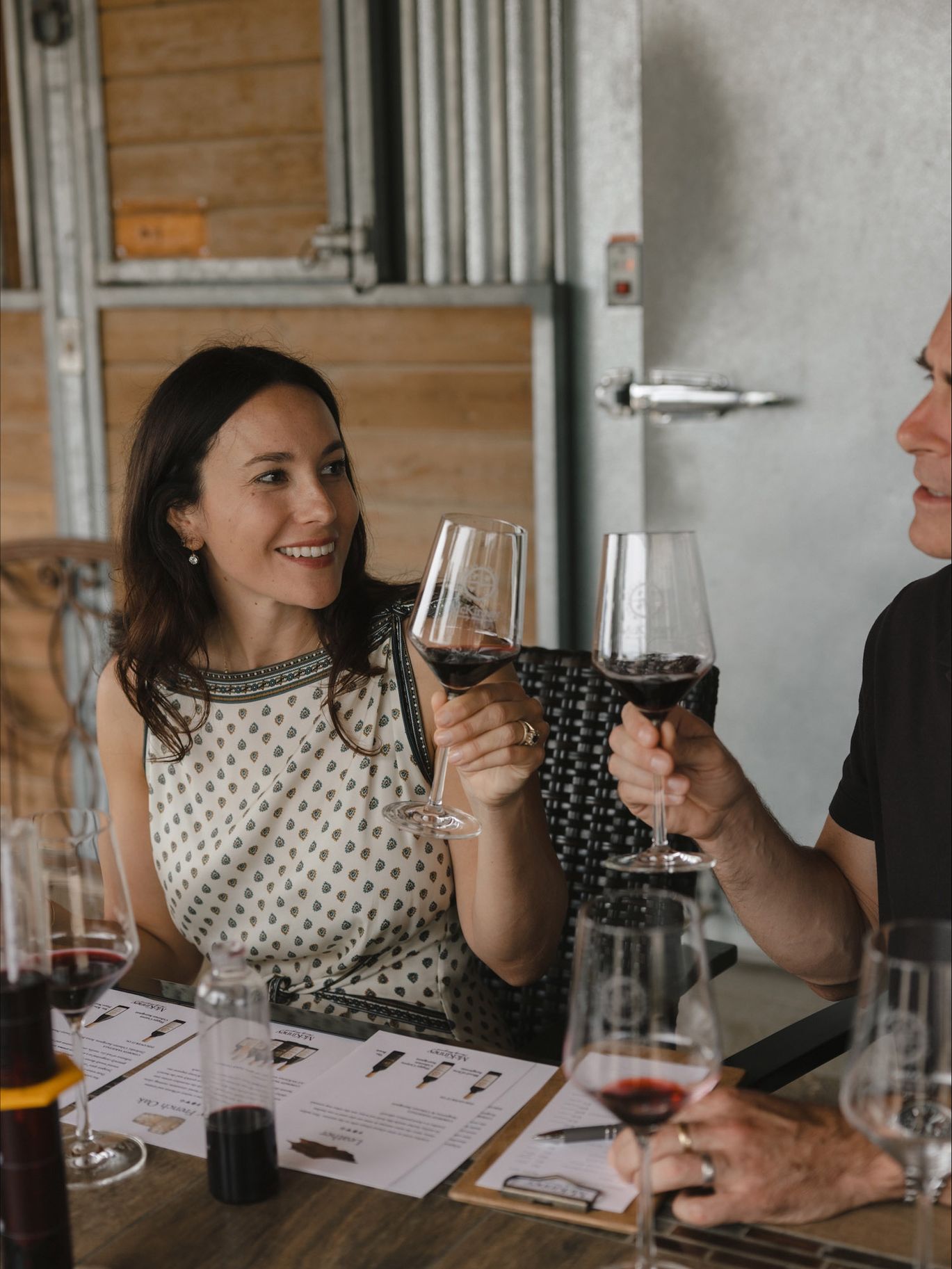 A guest raises a glass of red wine during The Ritz-Carlton Bacara, Santa Barbara’s Winemaker for a Day experience