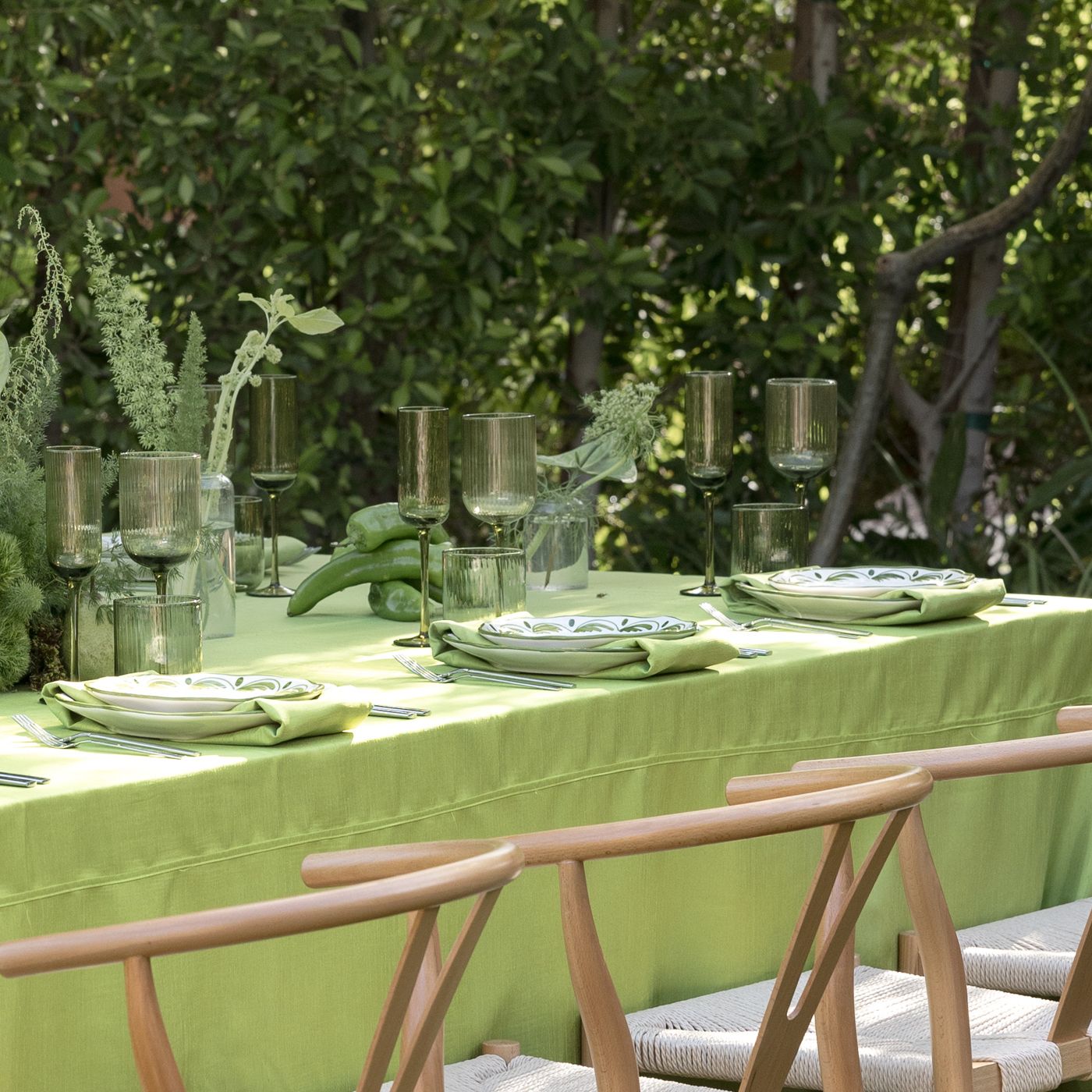 Green monochromatic tablescape featuring peppers and pears in wedding inspiration shoot at Royal Palms Resort and Spa