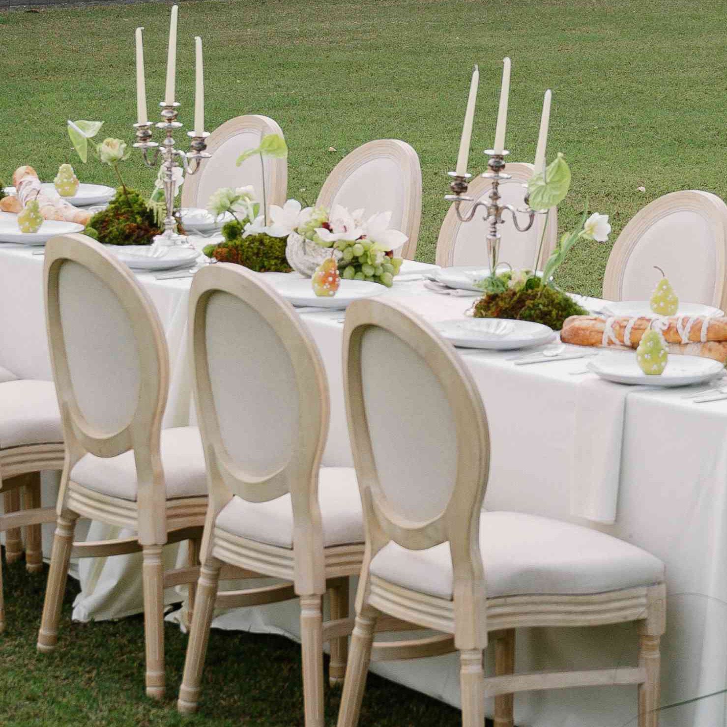 Monochromatic tablescape featuring lush greenery in editorial at private estate