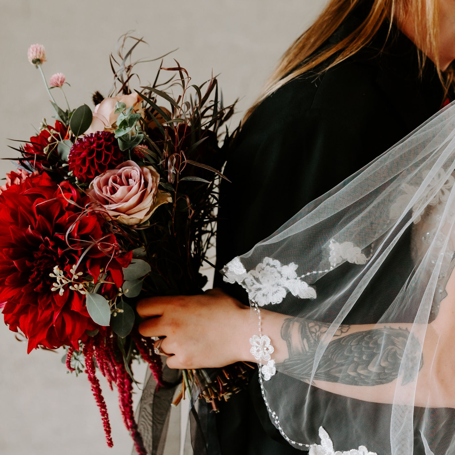 Close Up of Brittany and Daryian on their Wedding Day Featuring Moody Florals