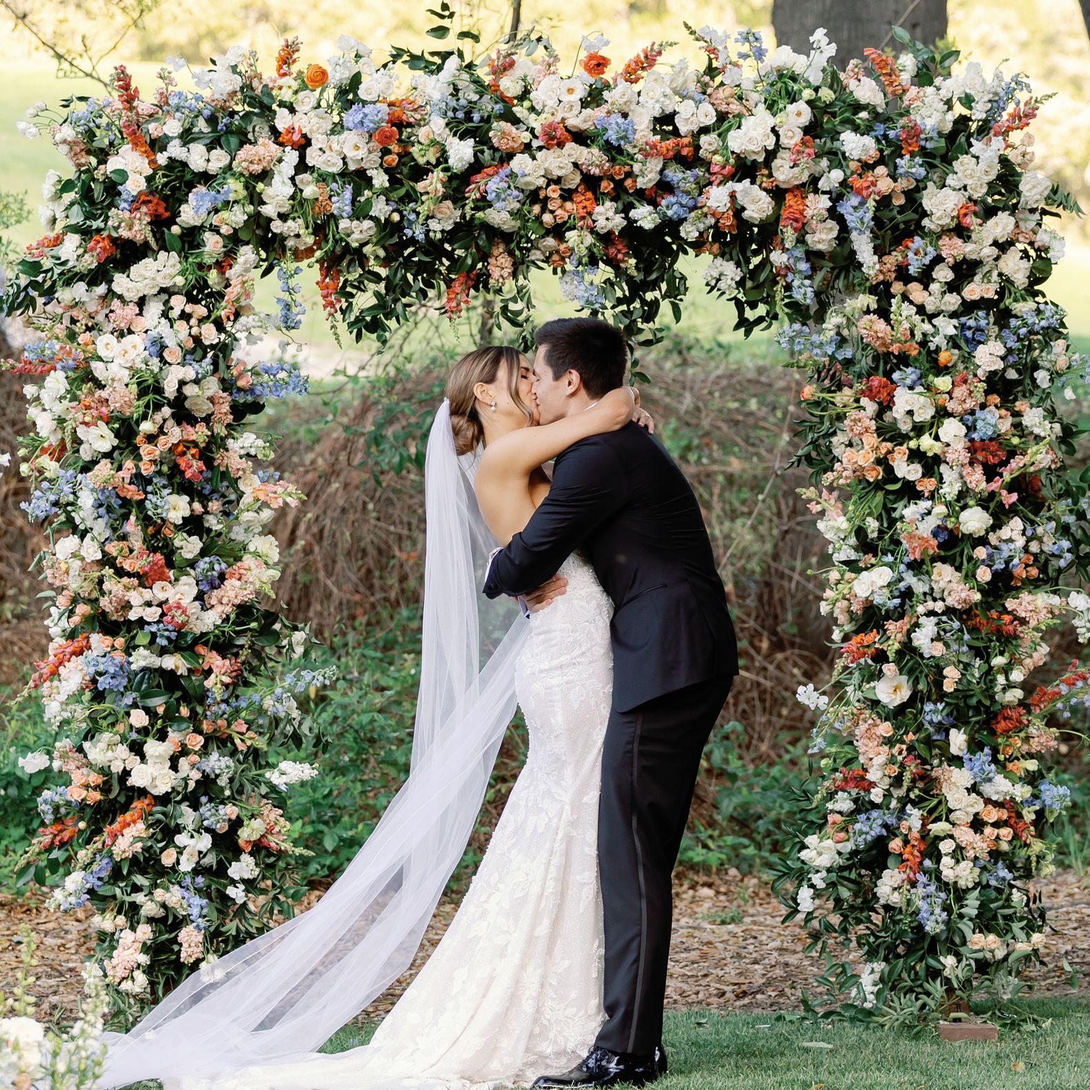 Colette and Dakoda's Springtime Outdoor Wedding Punctuated with Cornflower and Peach Florals at Temecula Creek Inn