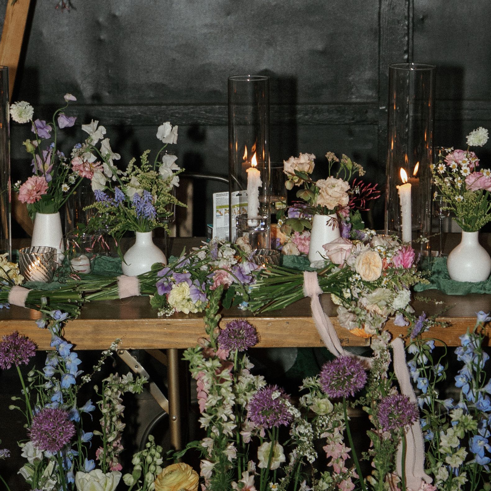 Verdant florals punctuate rustic table scape