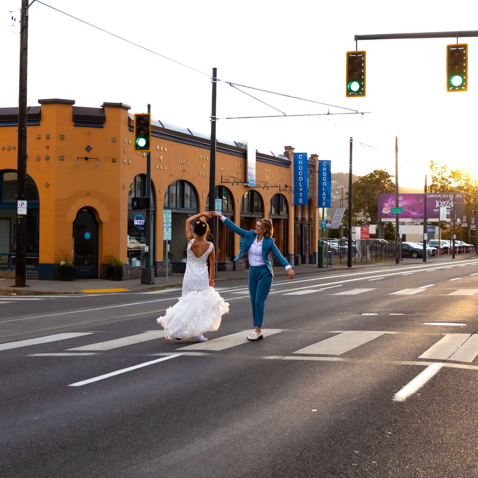 Couple dancing in the middle of the street during the golden hour of sunset