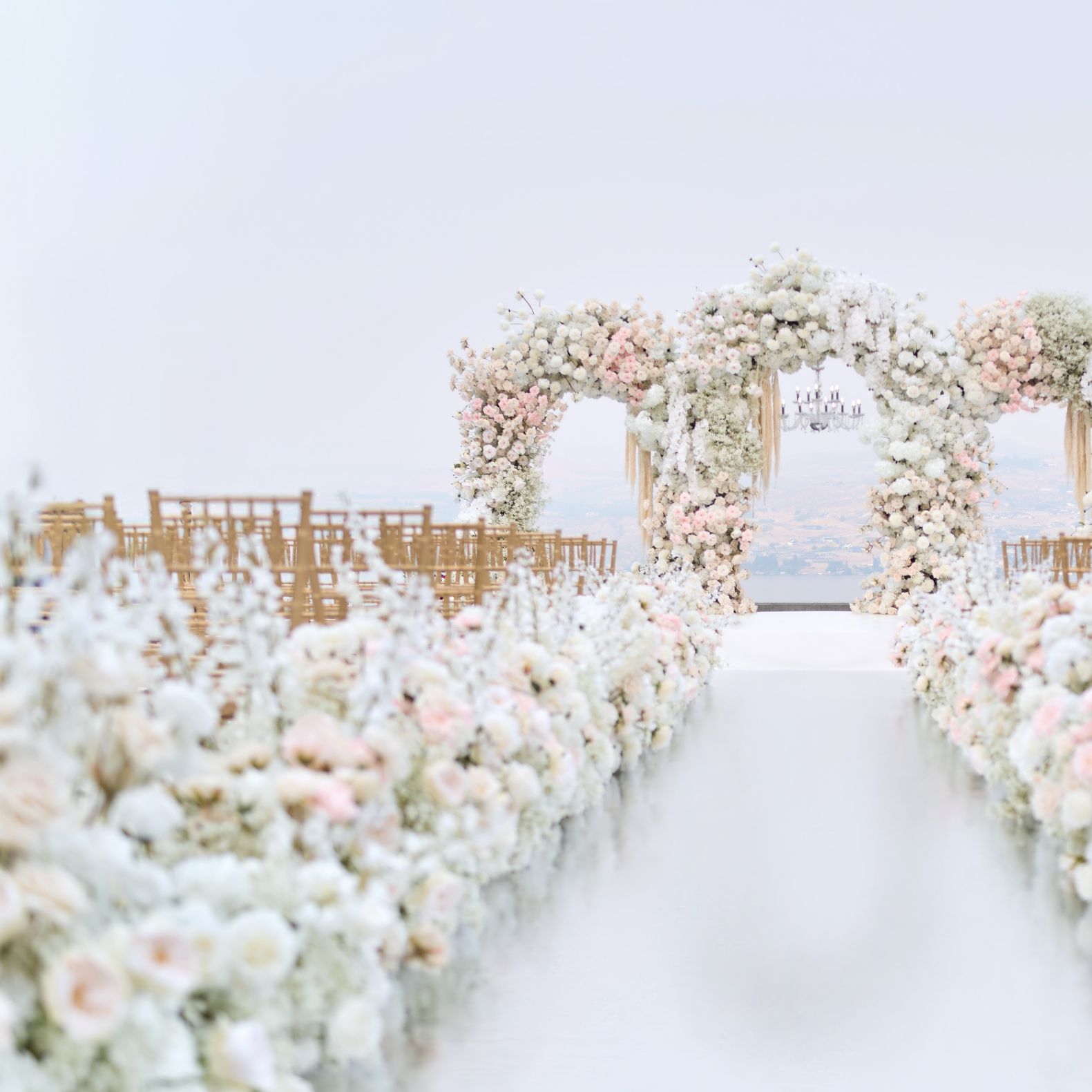 Lush all-white ceremony set up at Larc Hill Vineyard