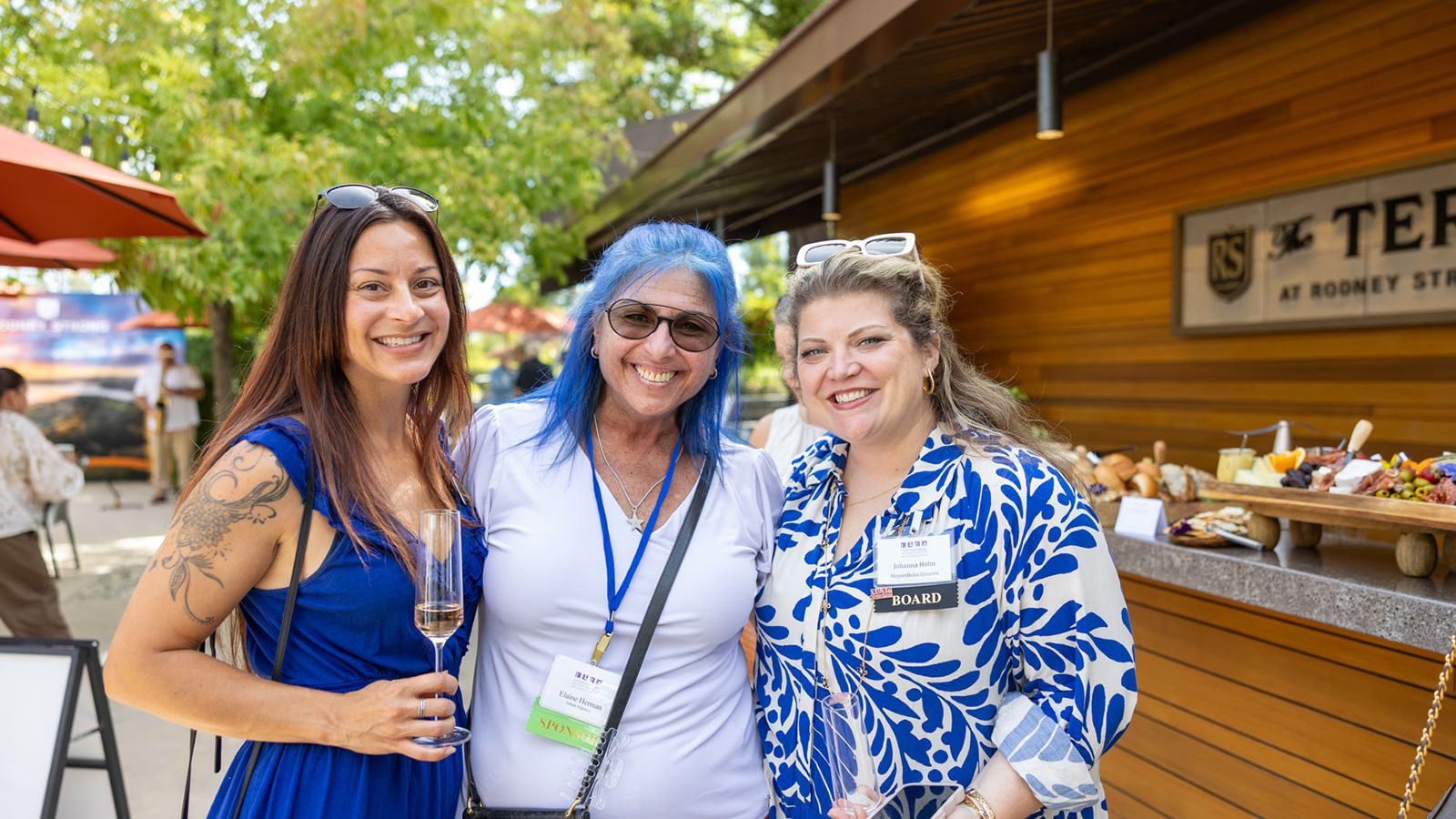 Three attendees pose together at the ILEA Napa-Sonoma event at Rodney Strong Vineyards