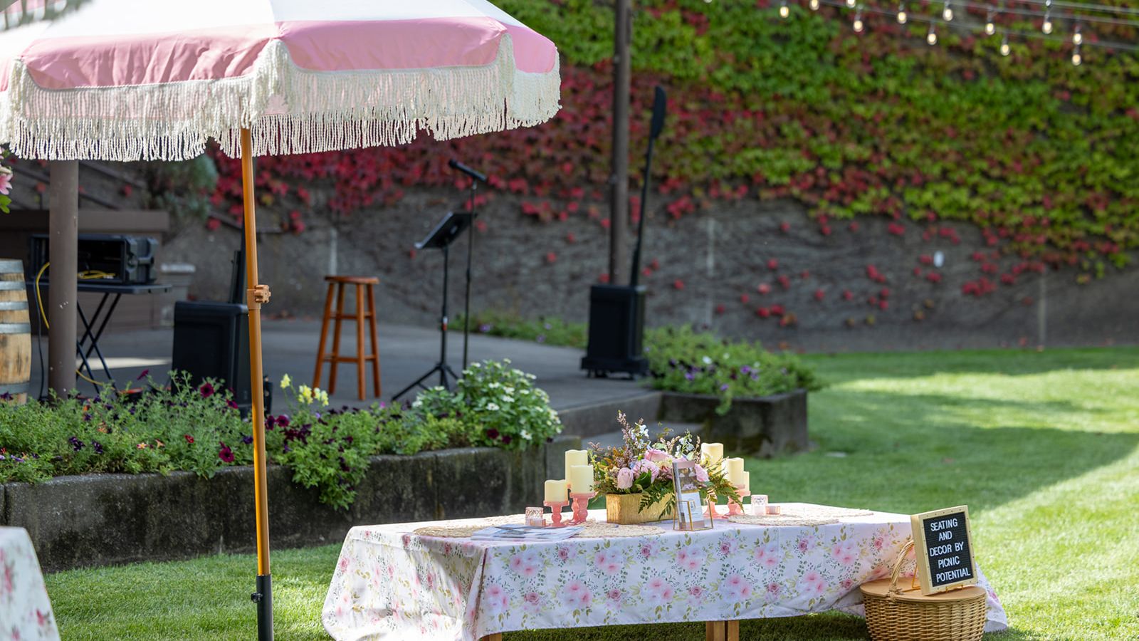 Outdoor event setup with colorful overhead décor at Rodney Strong Vineyards in Sonoma County