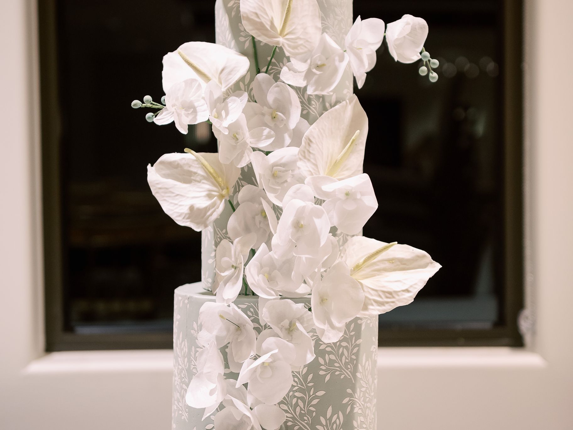 2025-07/sage-green-leaf-tiered-wedding-cake-sugar-flowers.jpg