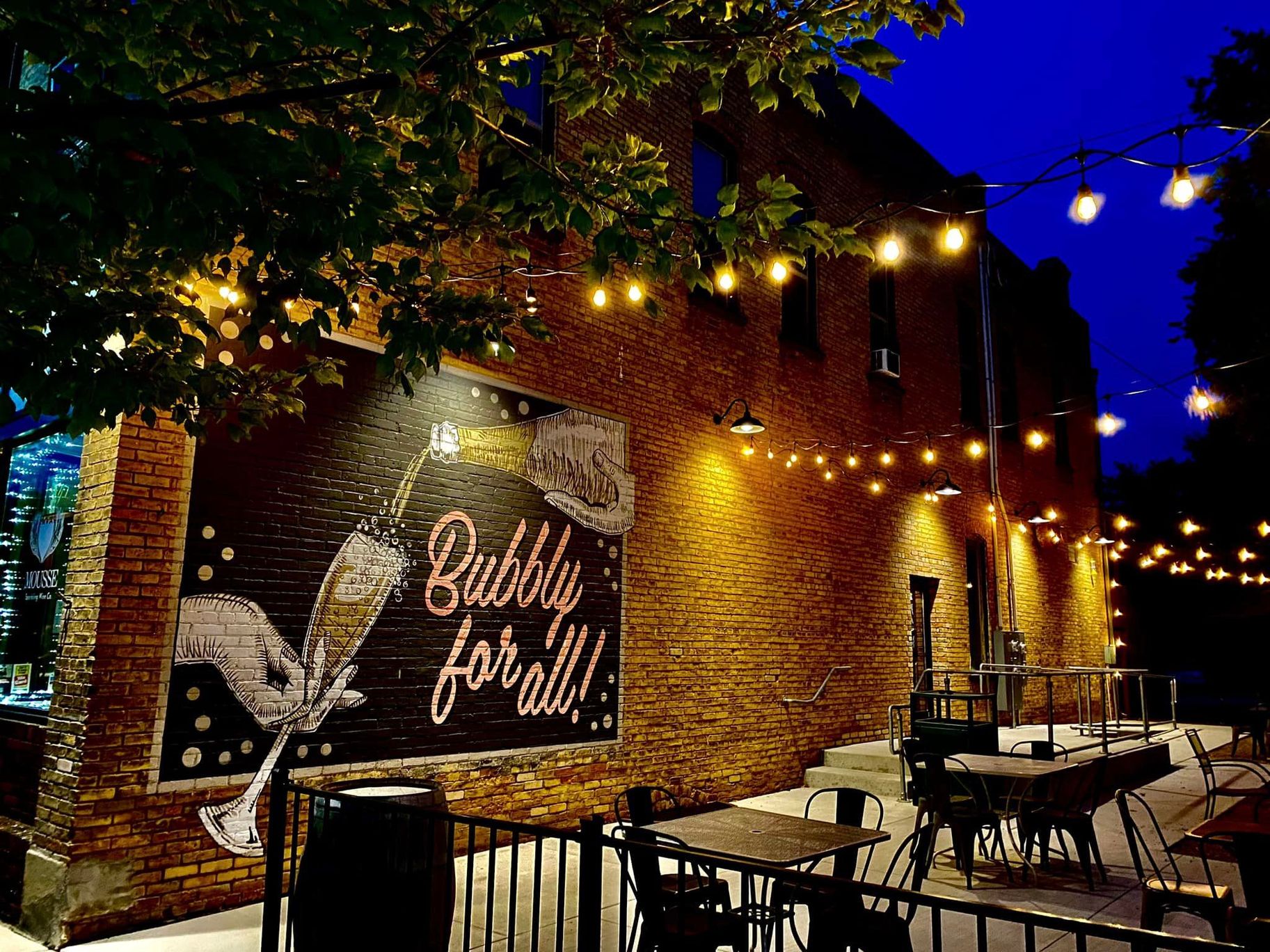 2025-07/Mousse patio at night magical with lights and mural_0.jpg
