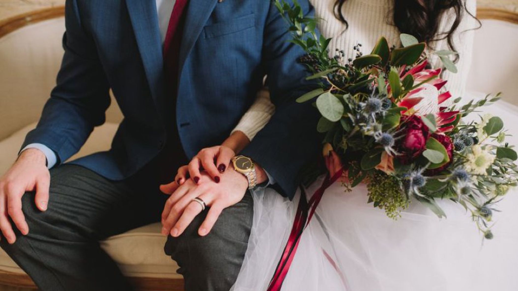 Wisconsin_Bride/StyledWinterShootMonicaCPhoto/866x578px.close_up_of_bride_and_groom_holding_hands_watch_and_jewelry_WEB.jpg