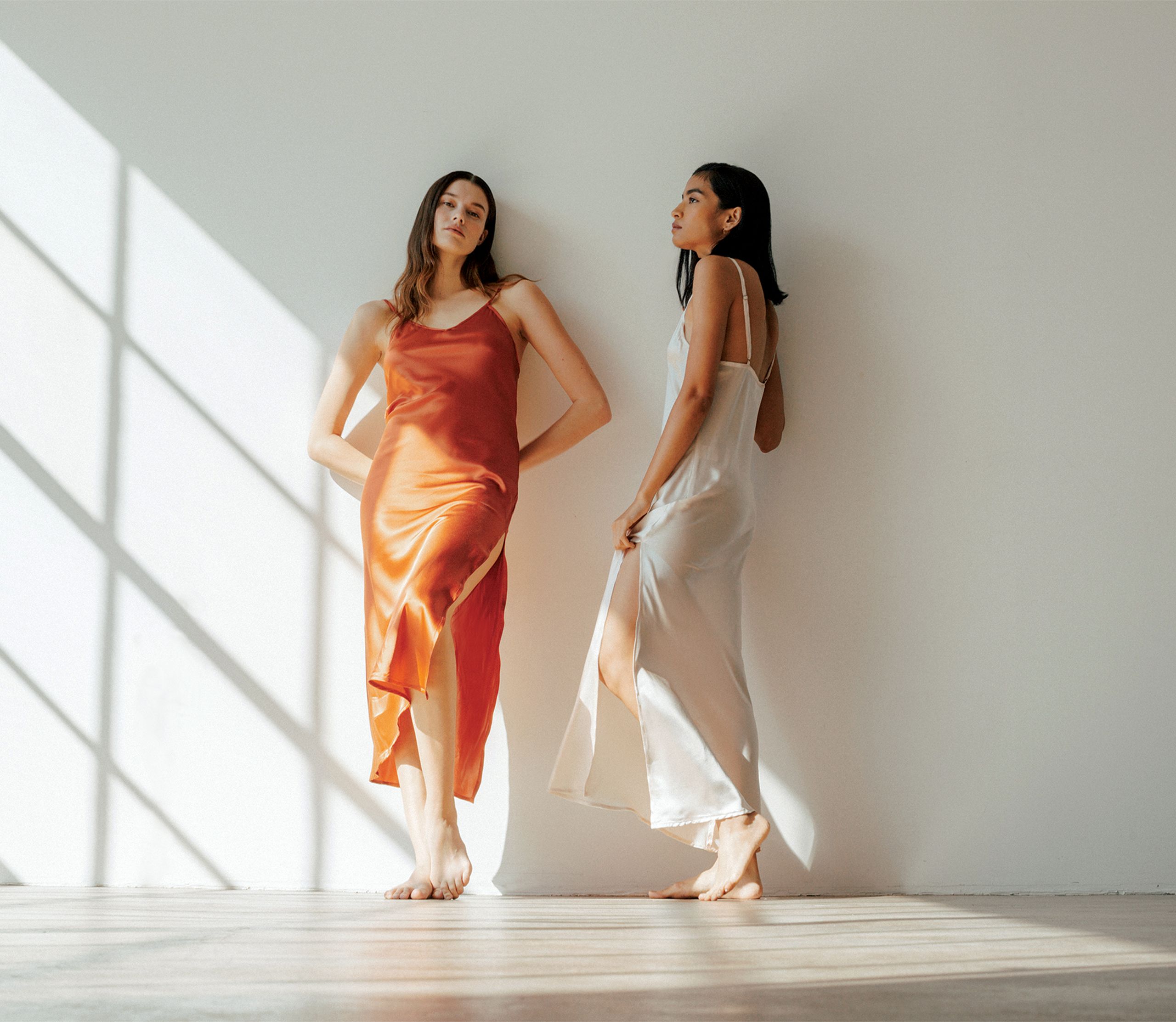 Two Models Pose in The Ruby Dress by Vincente
