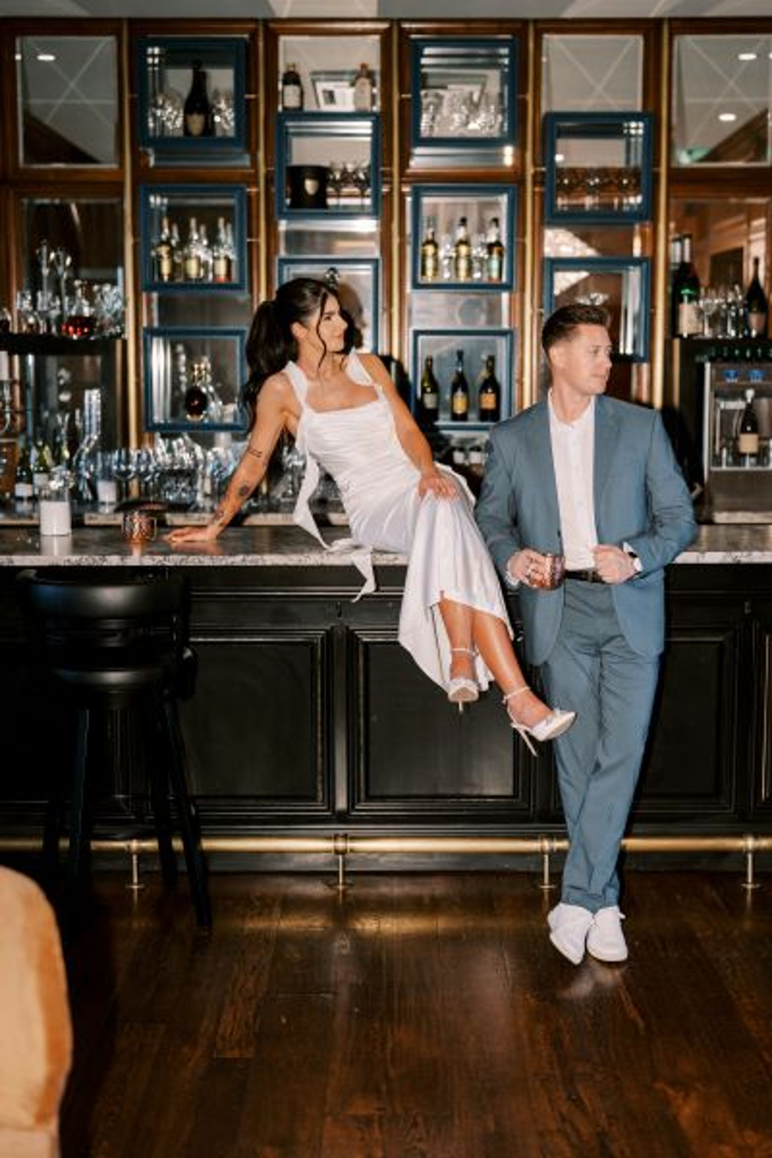 Moody-chic engagement session with a blue and orange color scheme at Wrigley Mansion