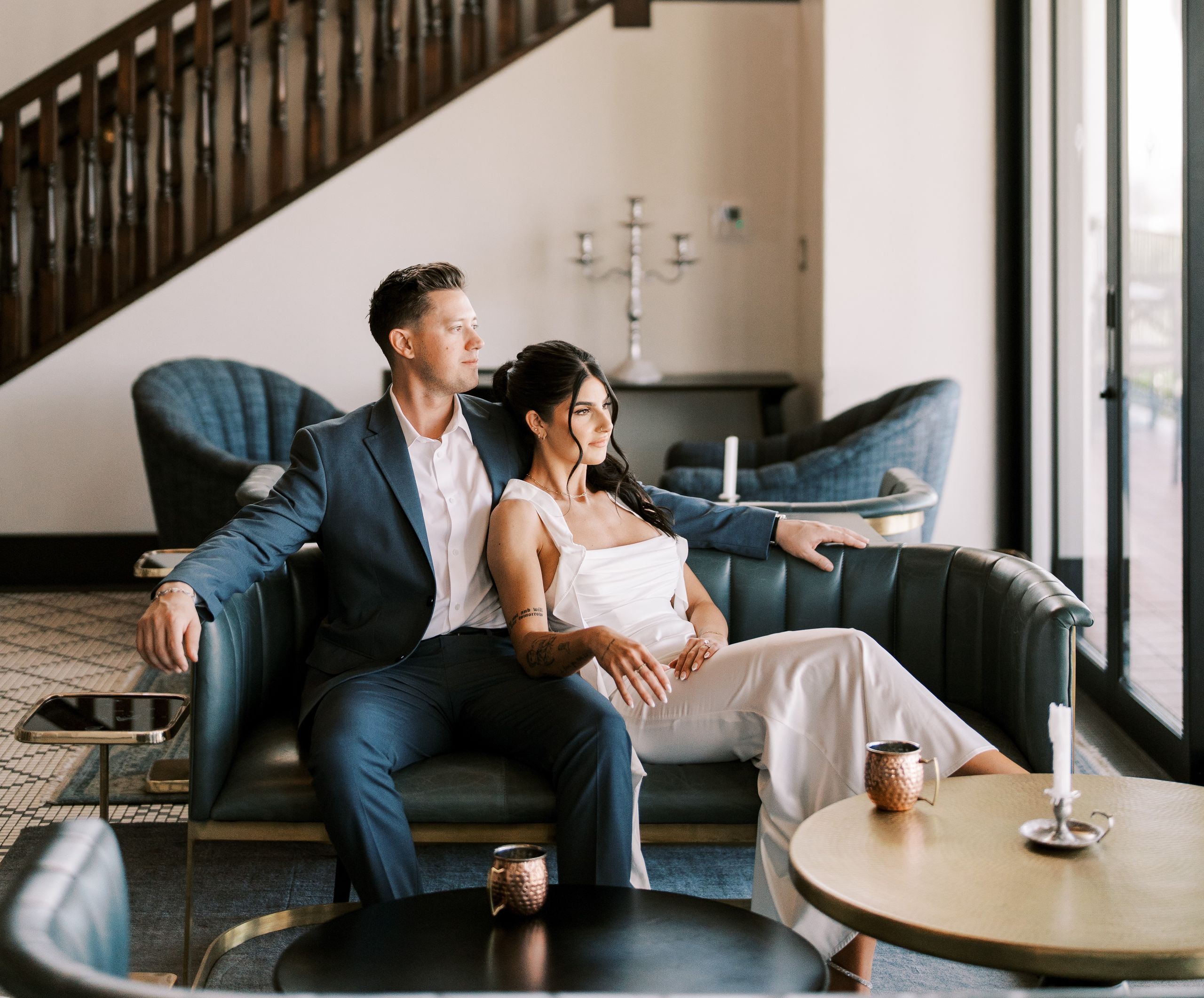 Moody-chic engagement session with a blue and orange color scheme at Wrigley Mansion