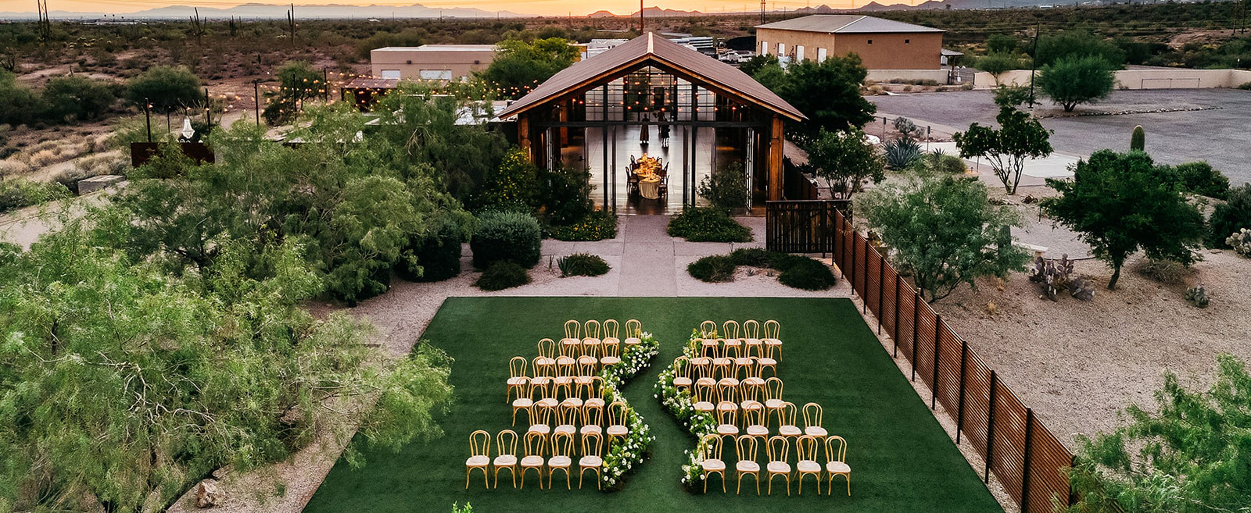 Sun sets in landscape shot of the editorial outdoor ceremony space at The Paseo