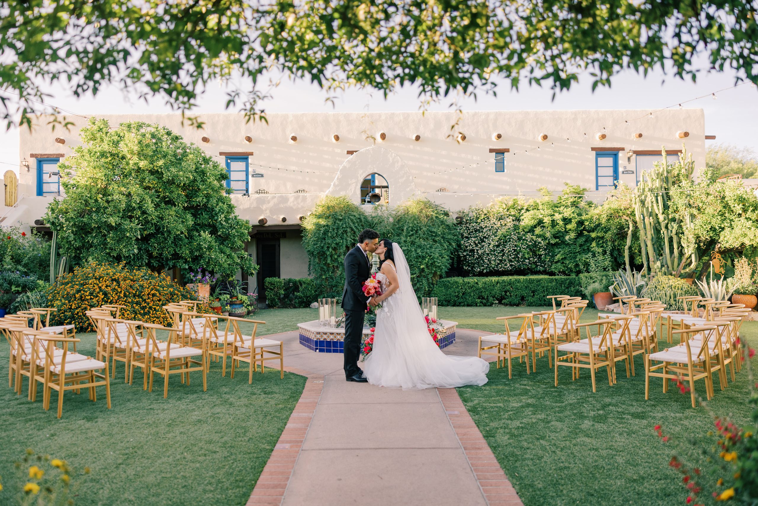 Models stand at the center of a circlular ceremony set-up in romantic editorial at Hacienda del Sol