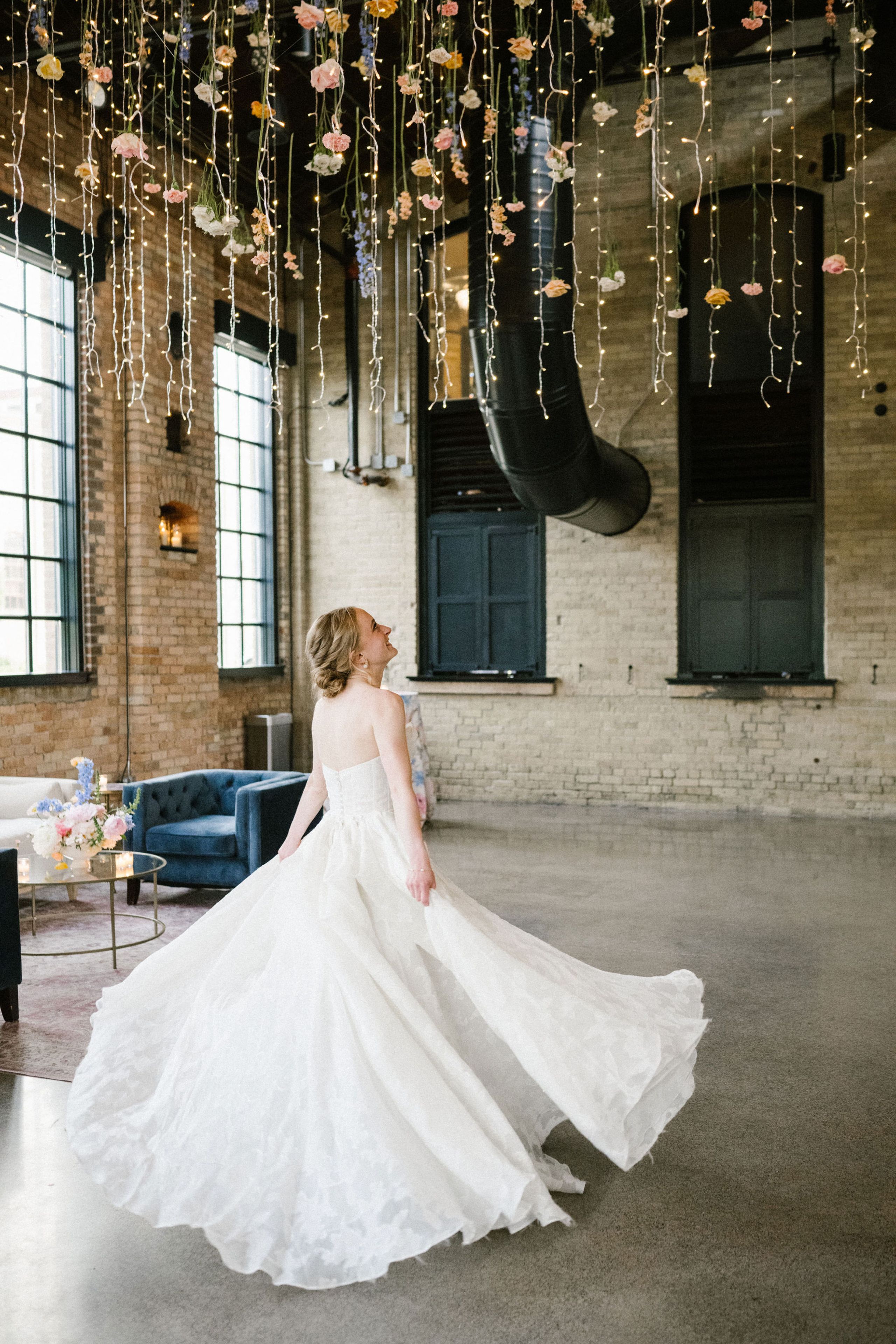 2026-06/Essence Center (Capiz chandelier and bride twirling) - Kellie Rae Studio .jpg