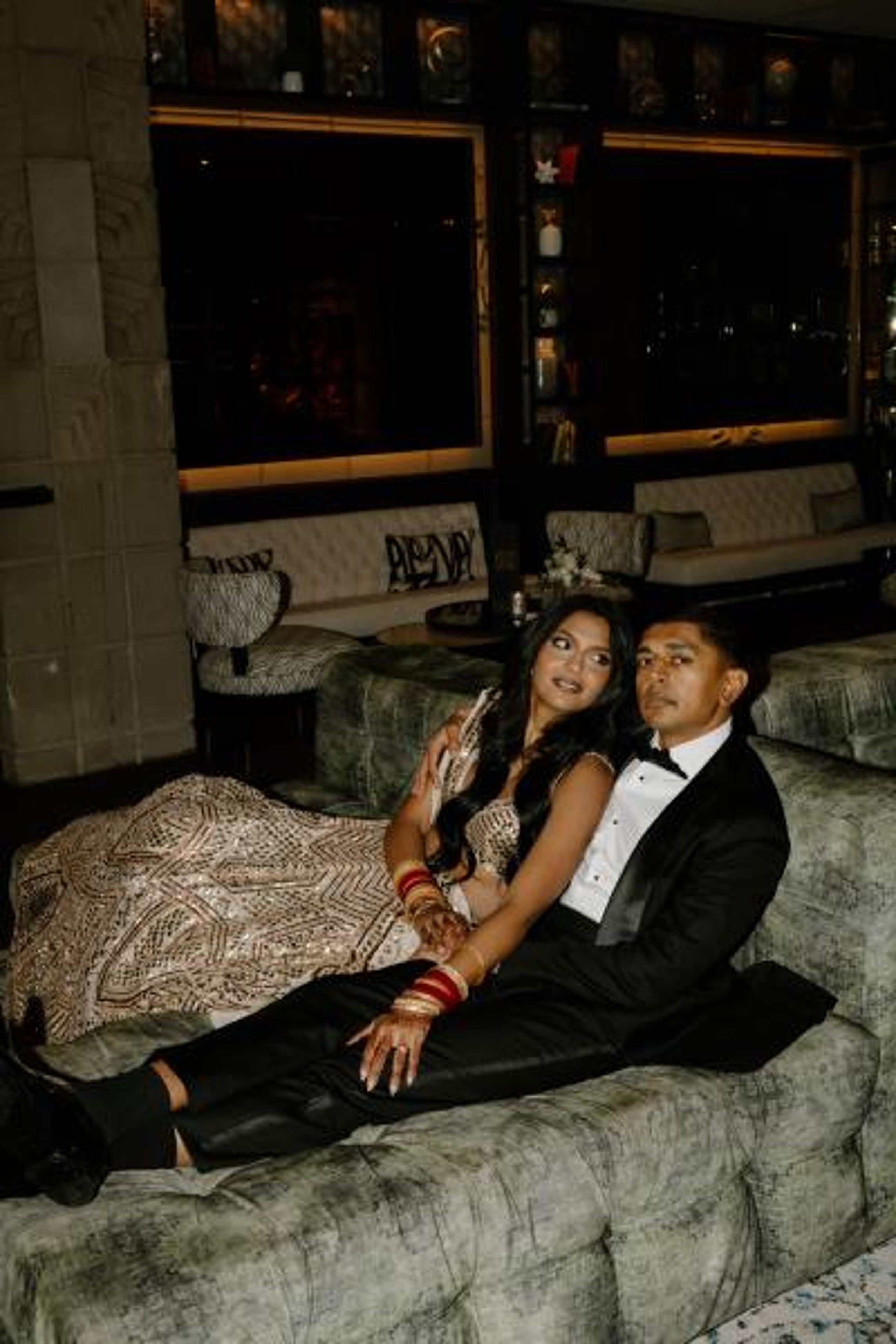 Nikita and Sahil pose before their reception in their opulent attire