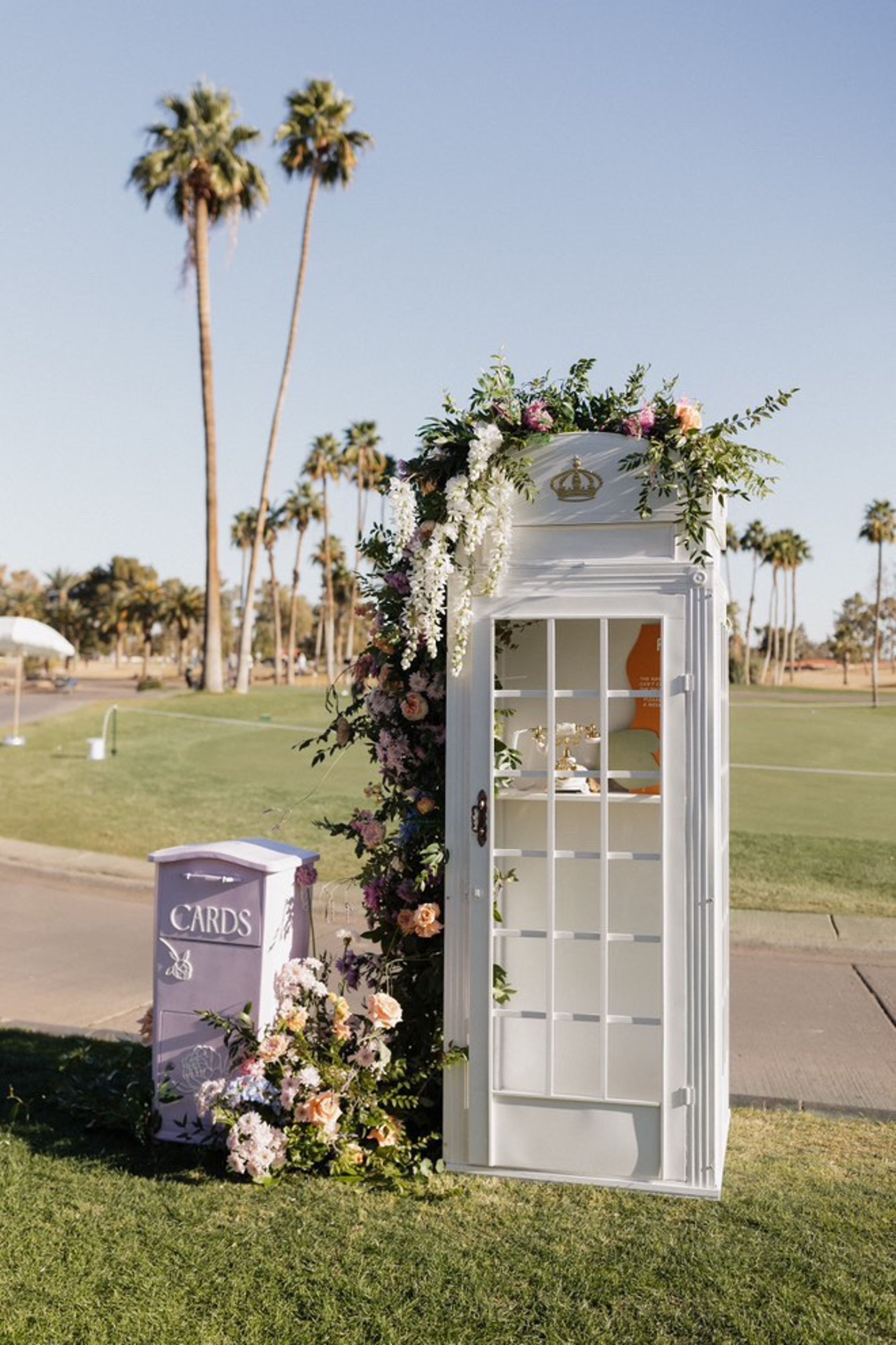 2025-03/Classic White phone booth w flowers_0.jpg