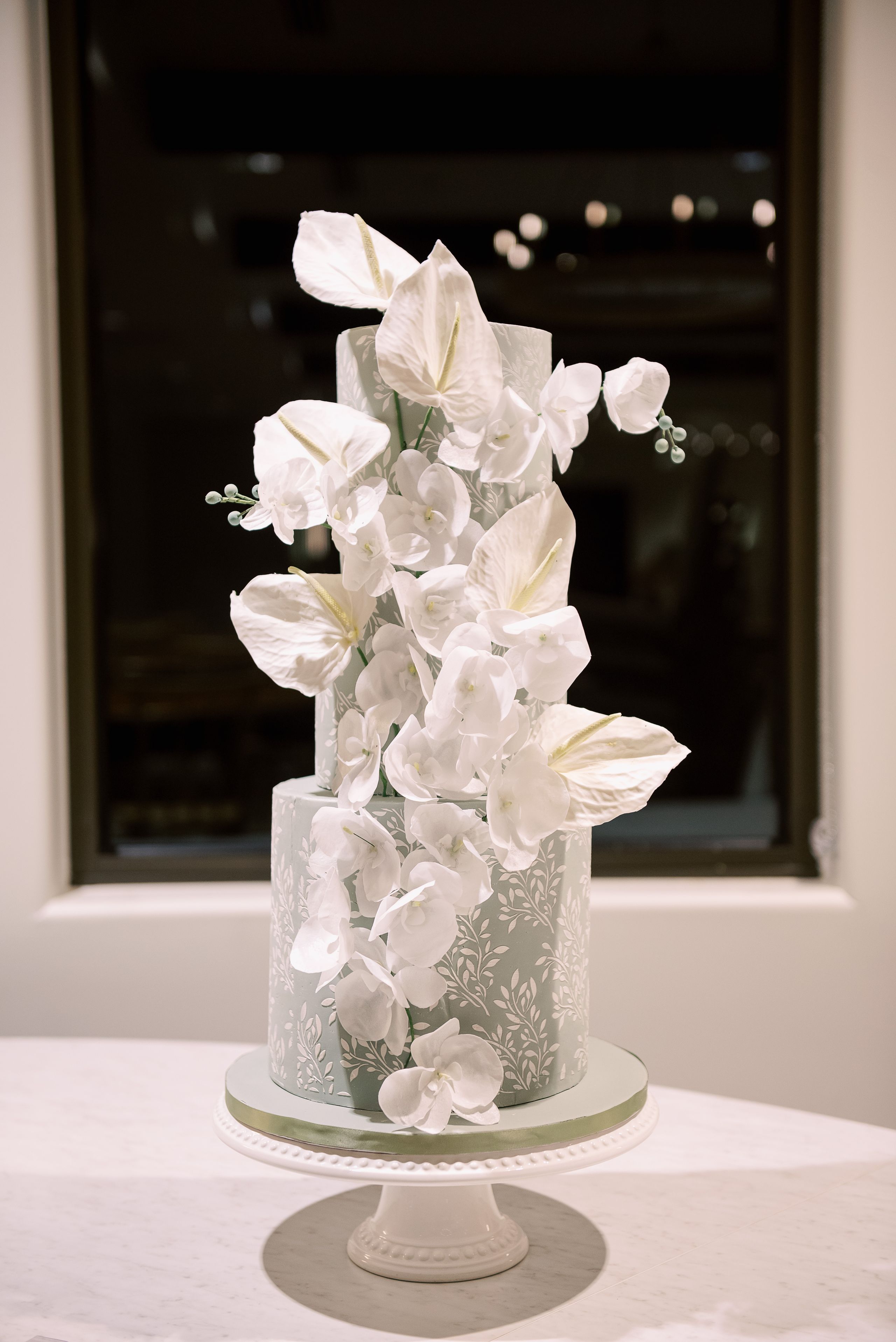2025-07/sage-green-leaf-tiered-wedding-cake-sugar-flowers.jpg