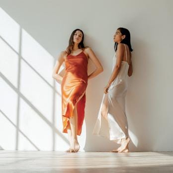 Two Models Pose in The Ruby Dress by Vincente