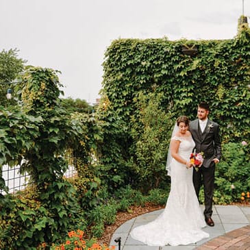 A bride and groom on a rooftop venue in Wisconsin