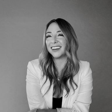 Black and white headshot of Editor in Chief Lauren Mang smiling