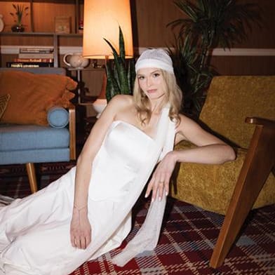 Model poses in retro-chic editorial at Graduate