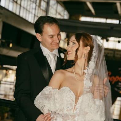 Bride and groom share a look with one another on their vintage inspired wedding day at The Cooperage